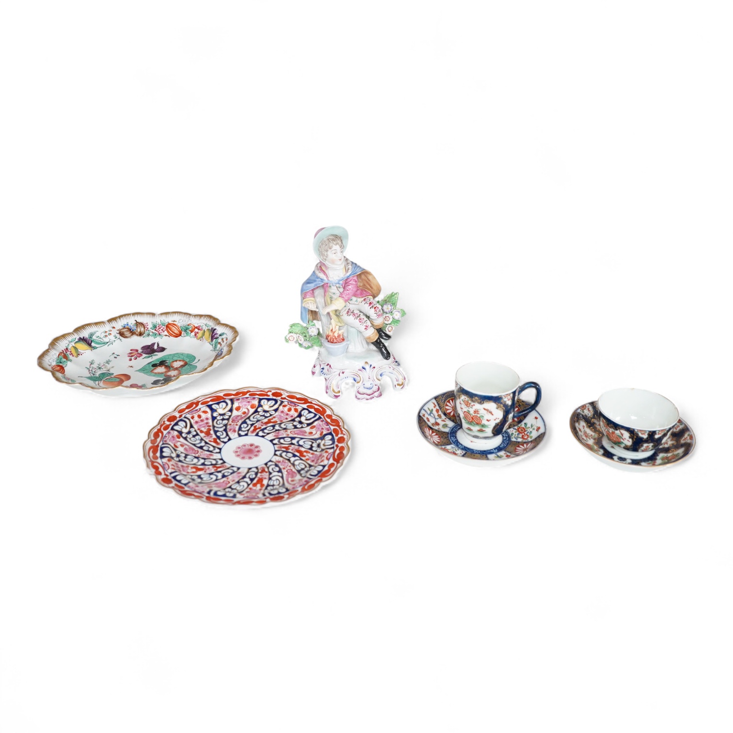 A Worcester Queen Charlotte pattern plate, Worcester scale blue coffee cup and teabowl, two French porcelain scale blue saucers, a fruit painted oval dish and a model of a boy emblematic of winter-19cm high